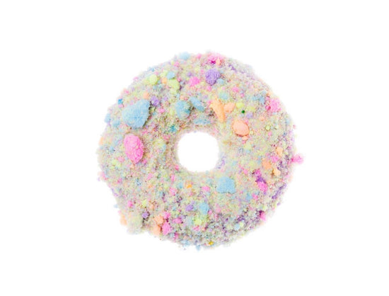 a pink donut with pink frosting and sprinkles 