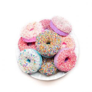 a pink donut with pink frosting and sprinkles 